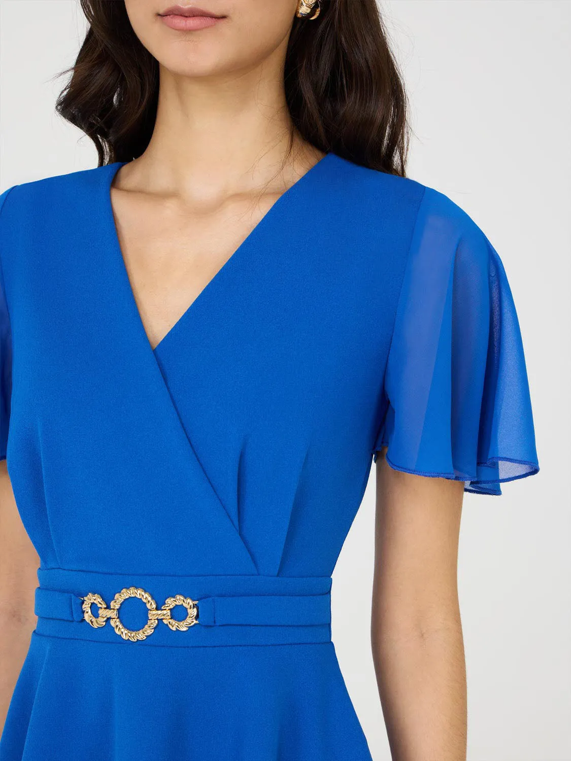 Crossover Peplum Top With Metal Belt Minimal Moves
